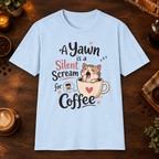 A Kitten’s Yawn T-Shirt in Light Blue, overhead coffee-bar flat-lay mockup