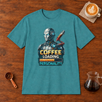 Coffee Loading Personality T-Shirt Heather Galapagos Blue flat lay on walnut coffee bar
