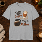 That’s Not a Coffee T-Shirt in Sport Grey, overhead coffee-bar flat-lay mockup