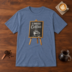 I Need Coffee T-Shirt Heather Indigo flat lay on walnut coffee bar