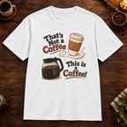 That’s Not a Coffee T-Shirt in White, overhead coffee-bar flat-lay mockup
