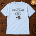 Notes of Rage T-Shirt in Light Blue on a dark wood coffee bar