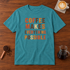 Coffee Makes Everything Possible text print T-Shirt Heather Galapagos Blue flat lay on walnut coffee bar