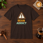Bean Addict T-Shirt Dark Chocolate flat lay on walnut coffee bar