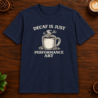 Decaf is Just Performance Art T-Shirt in Navy, close-up on dark wood coffee bar