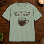 Sometimes It's My Only Friend T-Shirt in Sage on a dark wood coffee bar