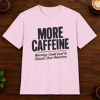 More Caffeine T-Shirt in Light Pink on a dark wood coffee bar
