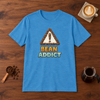 Bean Addict T-Shirt Heather Sapphire flat lay on walnut coffee bar
