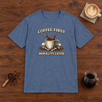 Coffee First Morality Later T-Shirt Heather Indigo flat lay on walnut coffee bar