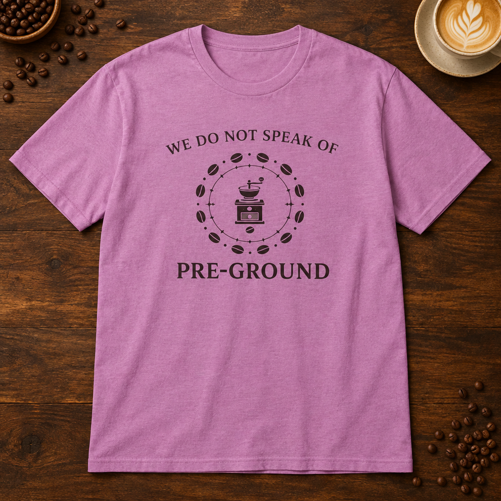 Pre-Ground T-Shirt in Heather Radiant Orchid on a dark wood coffee bar
