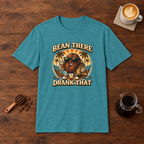 Bean There Drank That T-Shirt Heather Galapagos Blue flat lay on walnut coffee bar
