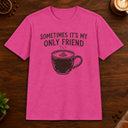 Sometimes It's My Only Friend T-Shirt in Heliconia on a dark wood coffee bar