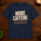 More Caffeine T-Shirt in Navy on a dark wood coffee bar