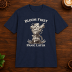 Bloom First T-Shirt in Navy on a wooden coffee-themed background