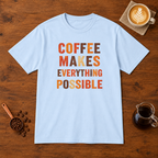 Coffee Makes Everything Possible text print T-Shirt Light Blue flat lay on walnut coffee bar