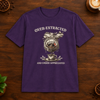 Over-Extracted T-Shirt in Purple on a wooden coffee-themed background
