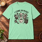 I Come in Peace T-Shirt Mint Green on warm coffee bar