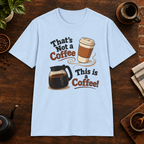 That’s Not a Coffee T-Shirt in Light Blue, overhead coffee-bar flat-lay mockup