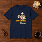 Caffeinated Over Everything T-Shirt Navy flat lay on walnut coffee bar