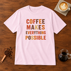 Coffee Makes Everything Possible text print T-Shirt Light Pink flat lay on walnut coffee bar